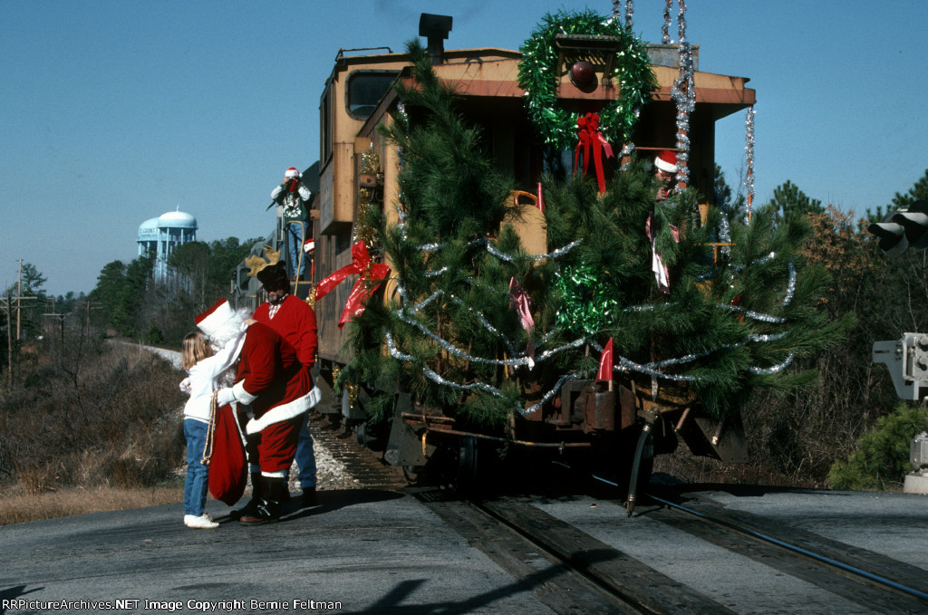 Santa Claus is using Chesapeake &amp; Ohio Railway caboose #903115 as his sleigh 